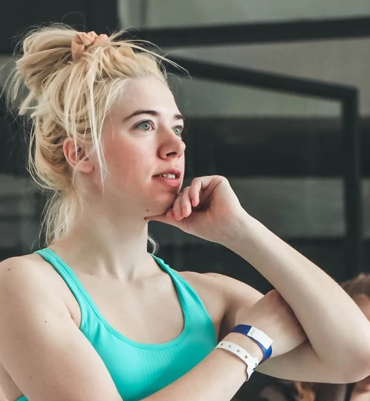 Anna Borovska resting her chin on her hand between classes in the studio